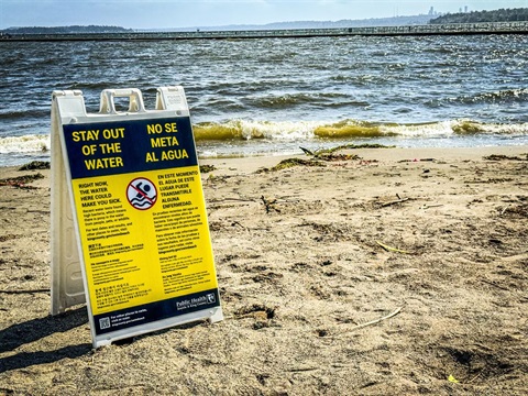 Sign at Juanita Beach stating to stay out of the water due to elevated bacteria.